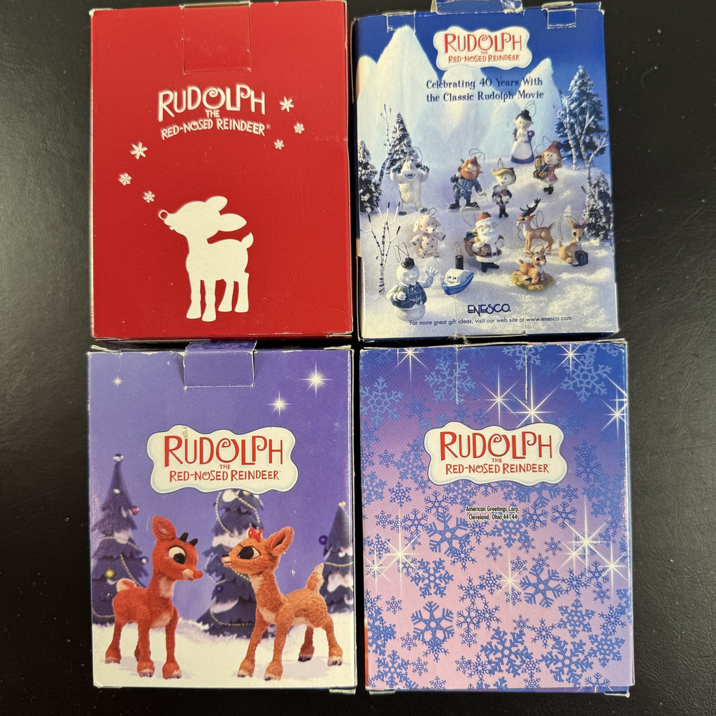 Set of 4 Enesco Rudolph the Red-Nosed Reindeer resin Christmas ornaments in original window boxes.