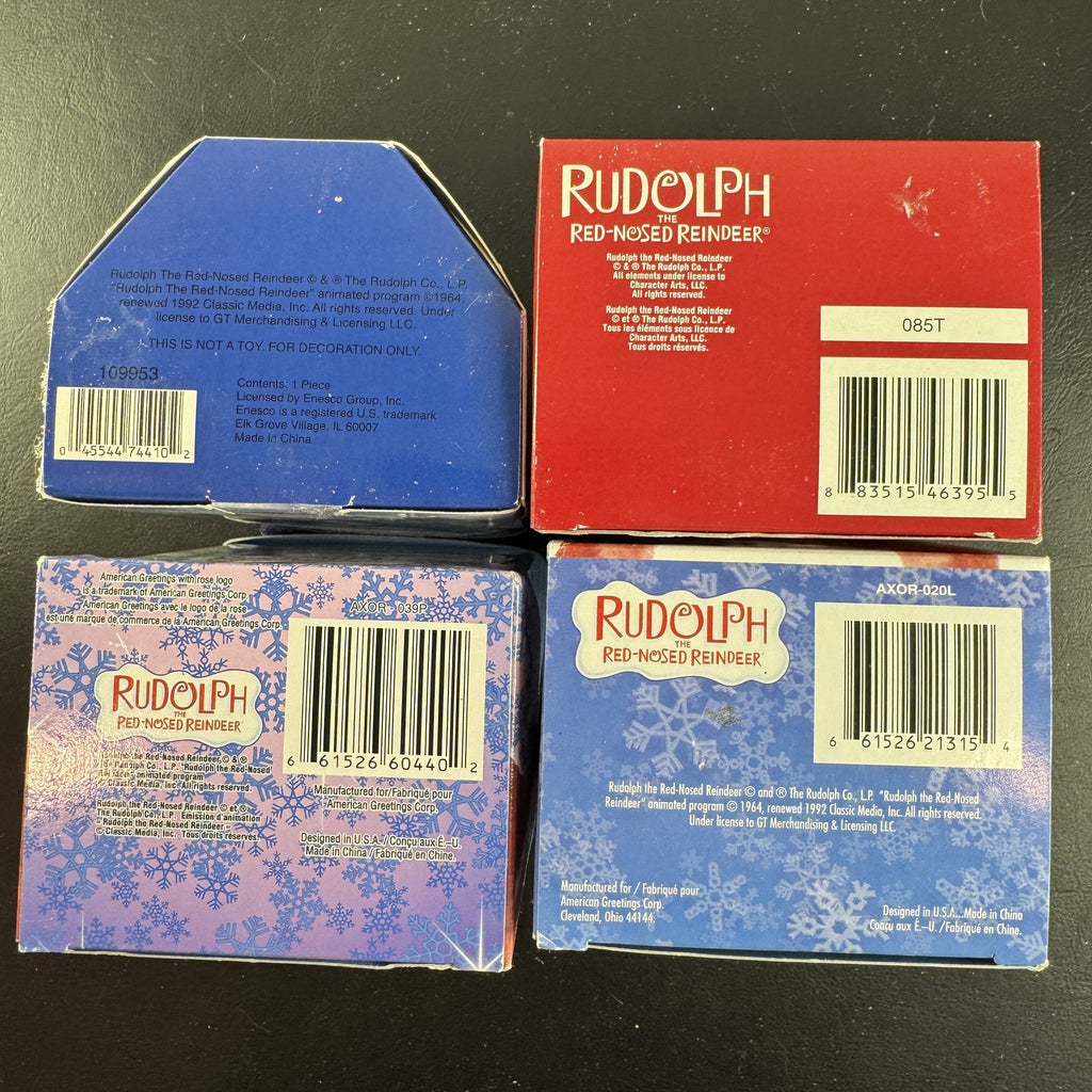 Set of 4 Enesco Rudolph the Red-Nosed Reindeer resin Christmas ornaments in original window boxes.