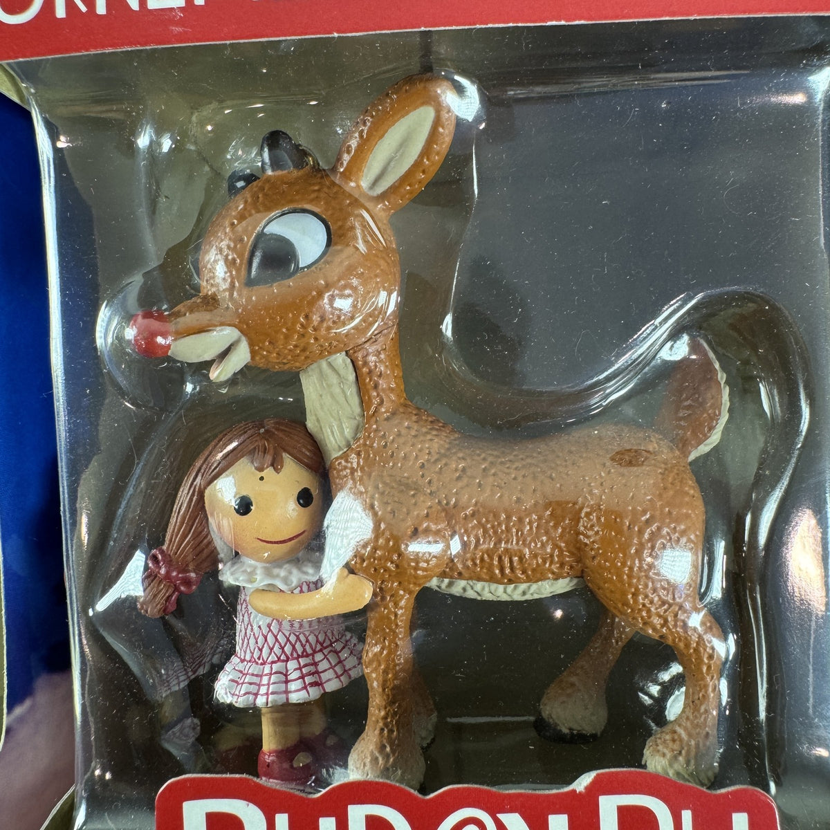 Set of 4 Enesco Rudolph the Red-Nosed Reindeer resin Christmas ornaments in original window boxes.