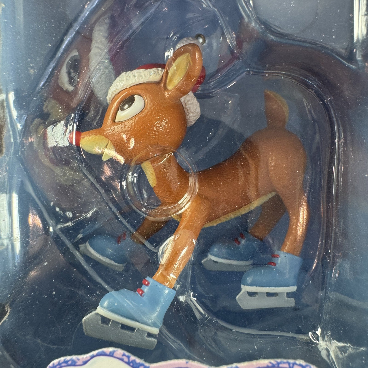 Set of 4 Enesco Rudolph the Red-Nosed Reindeer resin Christmas ornaments in original window boxes.
