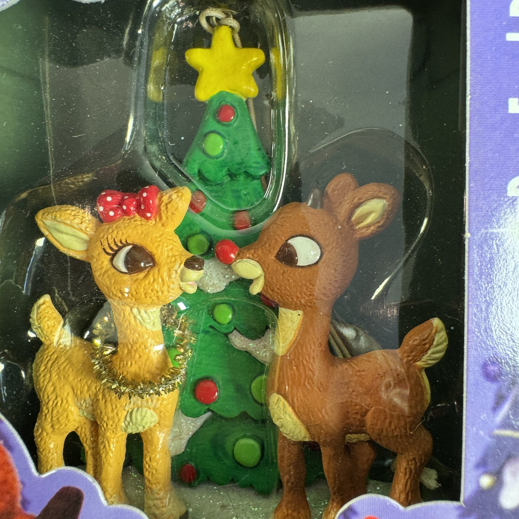 Set of 4 Enesco Rudolph the Red-Nosed Reindeer resin Christmas ornaments in original window boxes.