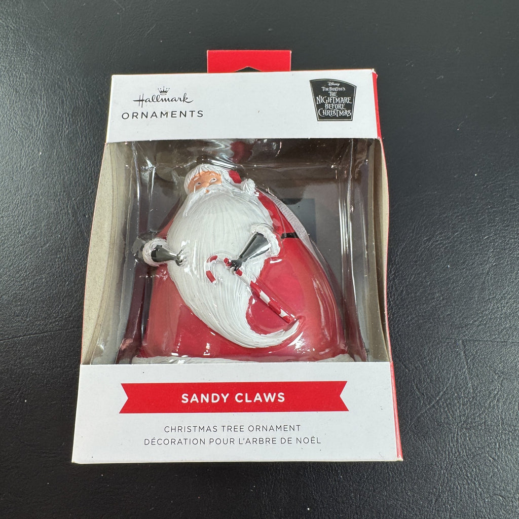 Hallmark Disney Nightmare Before Christmas Sandy Claws resin ornament in red suit holding a candy cane in original box