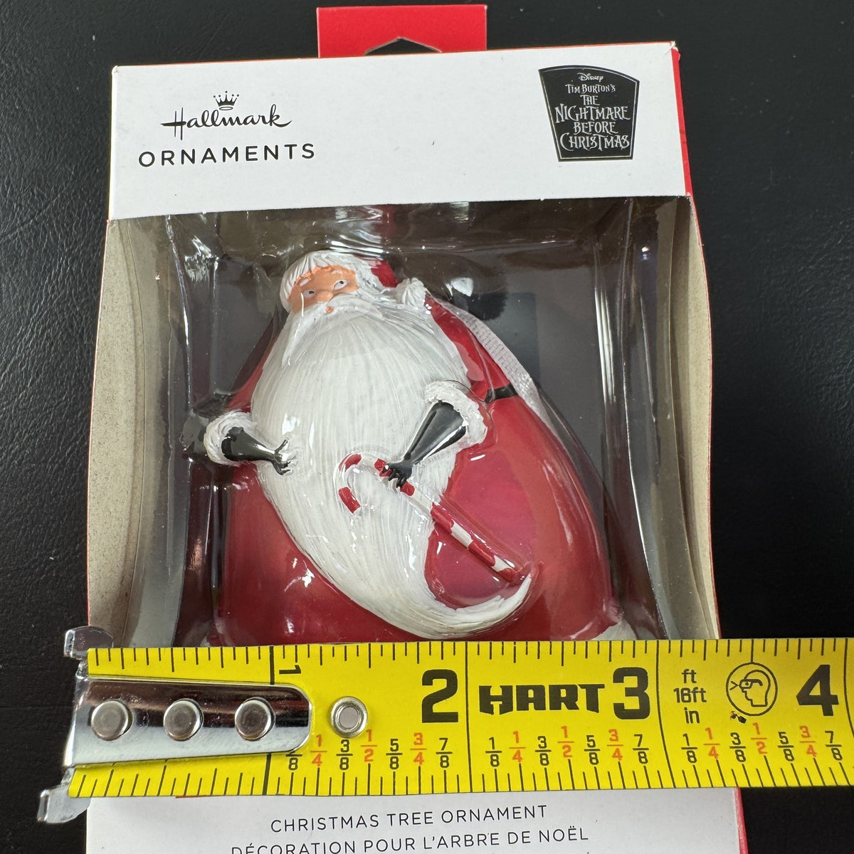 Hallmark Disney Nightmare Before Christmas Sandy Claws resin ornament in red suit holding a candy cane in original box