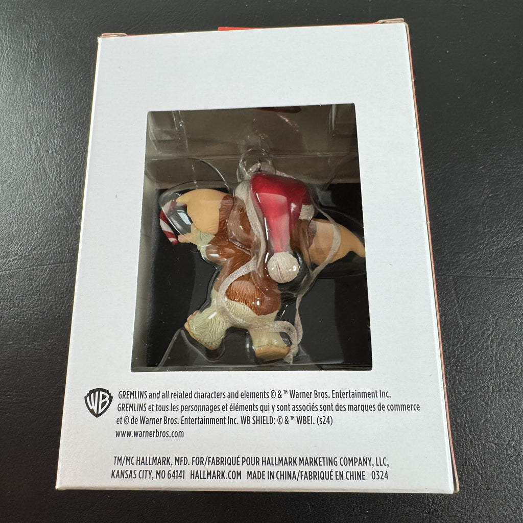 Hallmark 2024 Gremlins Gizmo resin Christmas ornament wearing a Santa hat and holding a candy cane in original packaging.