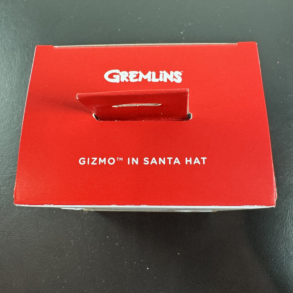 Hallmark 2024 Gremlins Gizmo resin Christmas ornament wearing a Santa hat and holding a candy cane in original packaging.