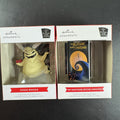 Set of two Hallmark Nightmare Before Christmas ornaments featuring Oogie Boogie holding dice and a retro VHS tape box.