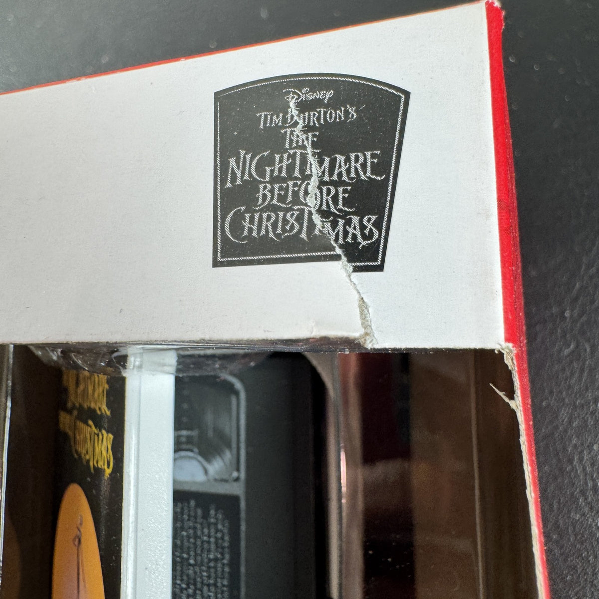 Set of two Hallmark Nightmare Before Christmas ornaments featuring Oogie Boogie holding dice and a retro VHS tape box.
