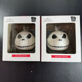 Set of two Hallmark Jack Skellington white blown glass Christmas ornaments in original packaging.