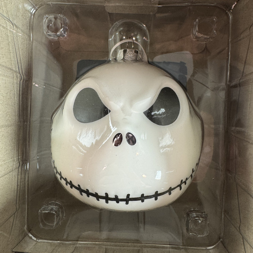 Set of two Hallmark Jack Skellington white blown glass Christmas ornaments in original packaging.