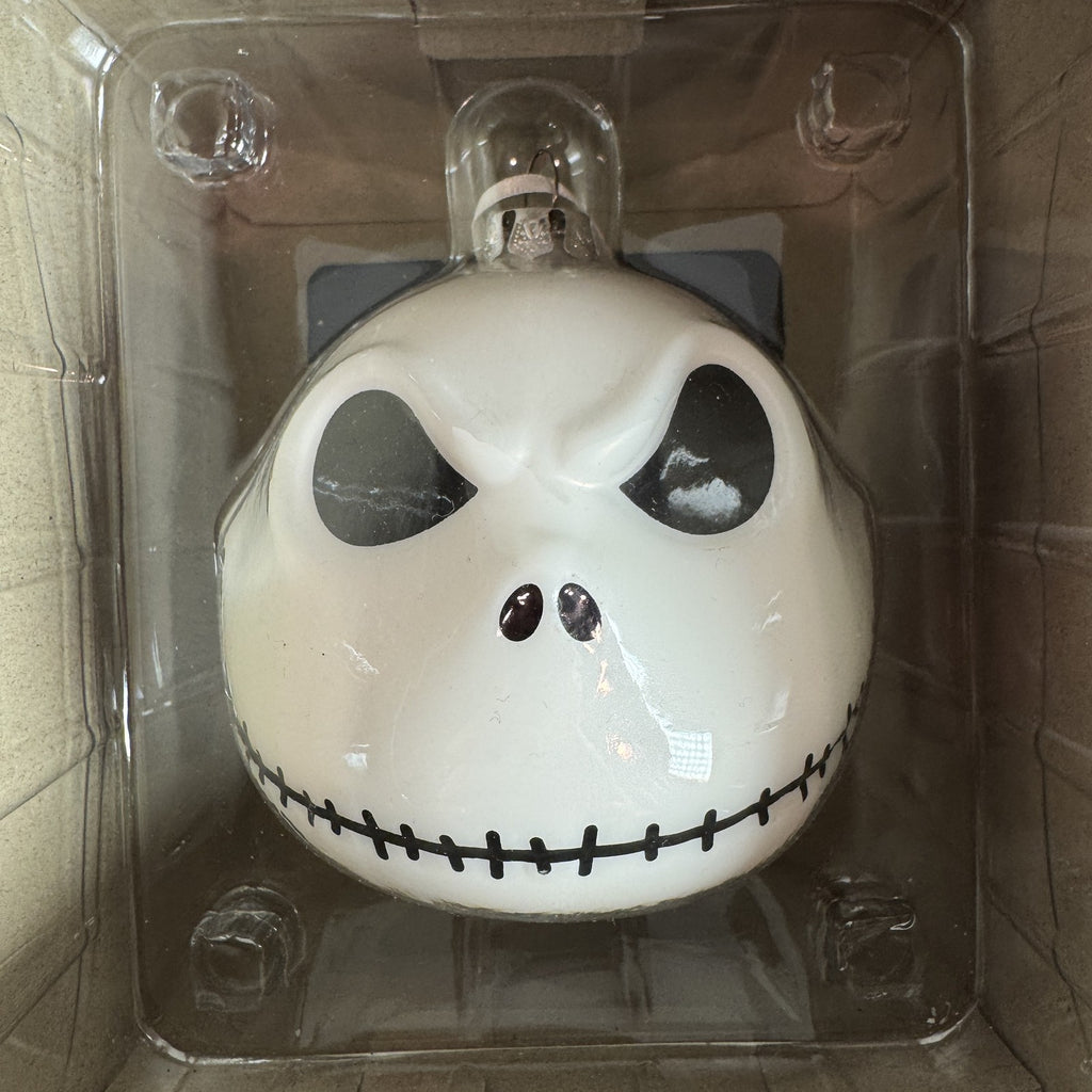 Set of two Hallmark Jack Skellington white blown glass Christmas ornaments in original packaging.