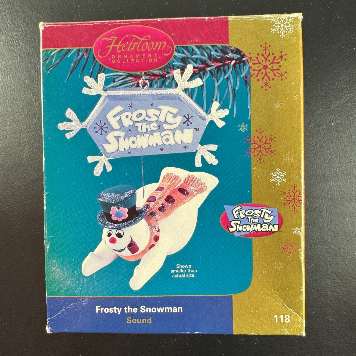 2004 Carlton Cards Heirloom Frosty the Snowman sound ornament flying under a snowflake sign in original worn box.
