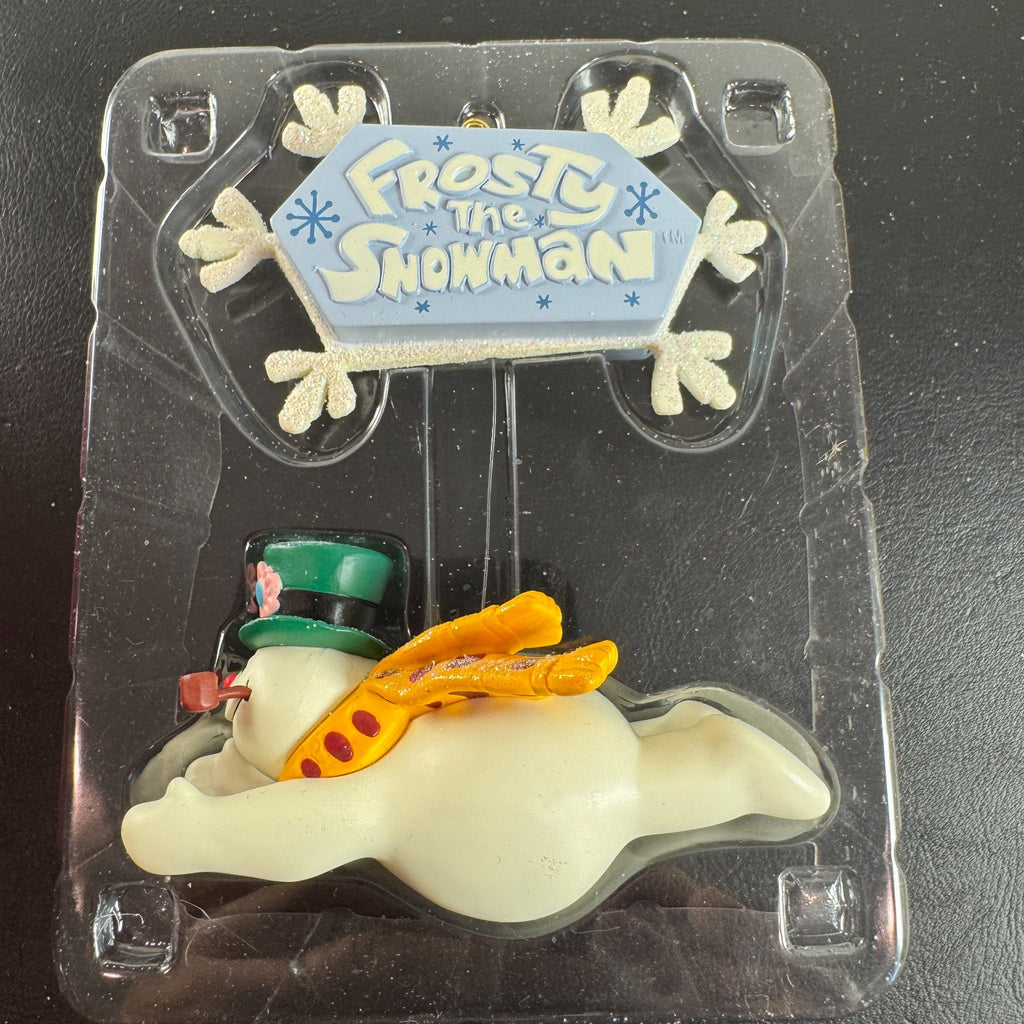 2004 Carlton Cards Heirloom Frosty the Snowman sound ornament flying under a snowflake sign in original worn box.