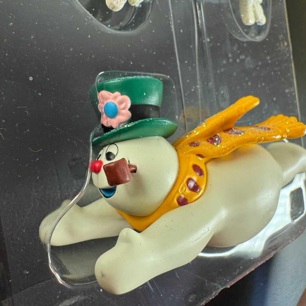 2004 Carlton Cards Heirloom Frosty the Snowman sound ornament flying under a snowflake sign in original worn box.