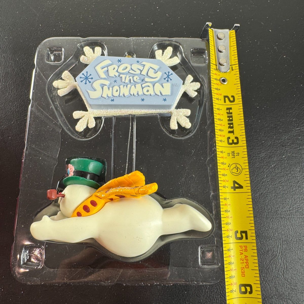 2004 Carlton Cards Heirloom Frosty the Snowman sound ornament flying under a snowflake sign in original worn box.