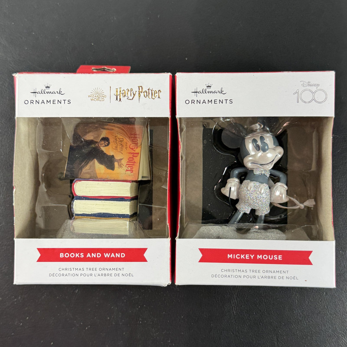 Set of 2 Hallmark ornaments featuring Disney 100 silver glitter Mickey Mouse and Harry Potter Hogwarts books in original boxes