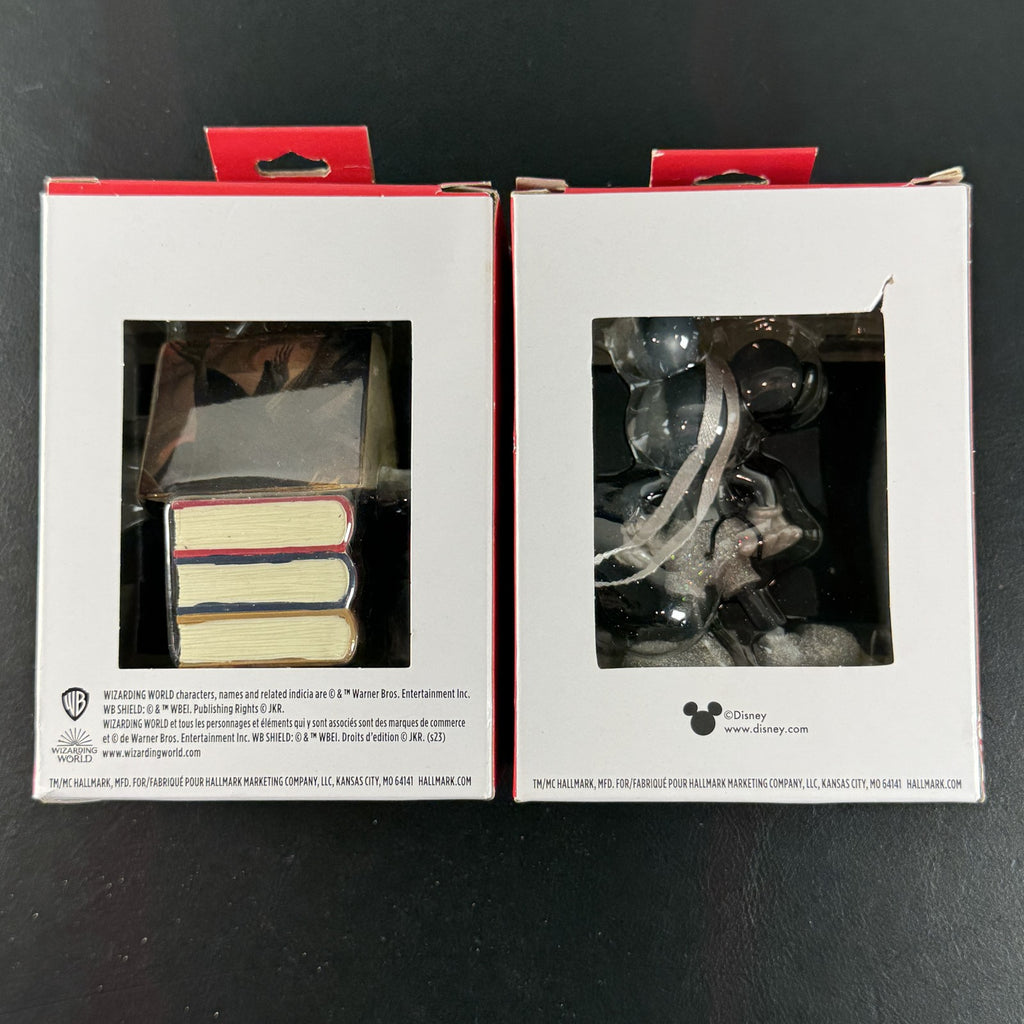 Set of 2 Hallmark ornaments featuring Disney 100 silver glitter Mickey Mouse and Harry Potter Hogwarts books in original boxes