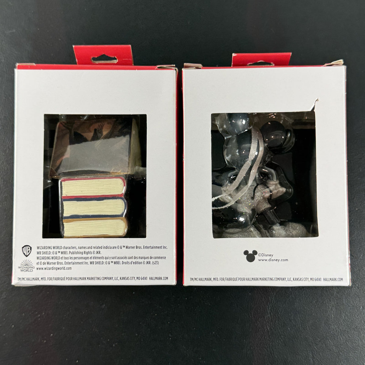 Set of 2 Hallmark ornaments featuring Disney 100 silver glitter Mickey Mouse and Harry Potter Hogwarts books in original boxes