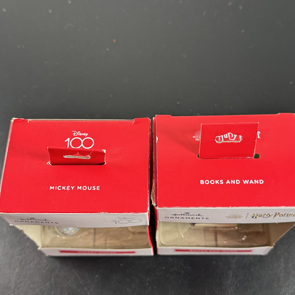 Set of 2 Hallmark ornaments featuring Disney 100 silver glitter Mickey Mouse and Harry Potter Hogwarts books in original boxes