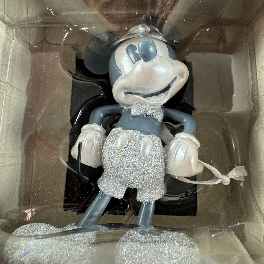 Set of 2 Hallmark ornaments featuring Disney 100 silver glitter Mickey Mouse and Harry Potter Hogwarts books in original boxes