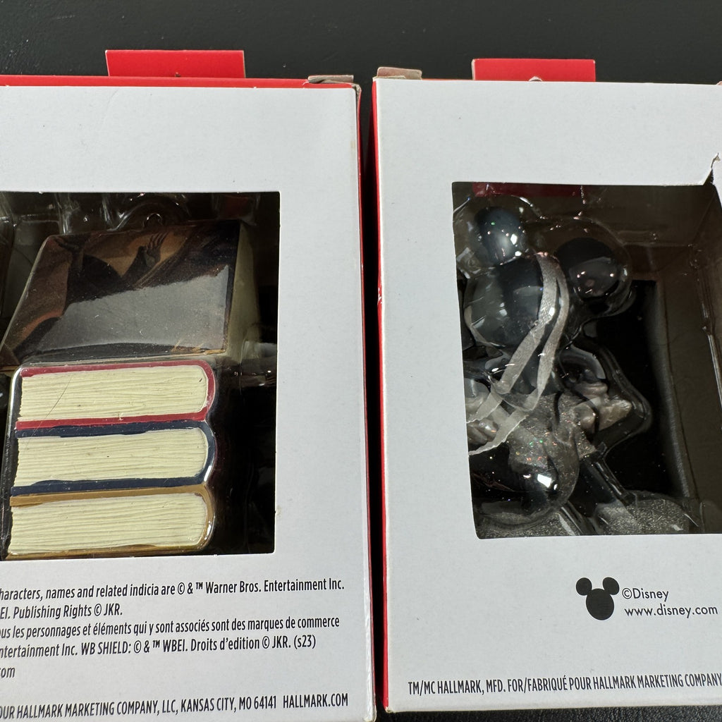 Set of 2 Hallmark ornaments featuring Disney 100 silver glitter Mickey Mouse and Harry Potter Hogwarts books in original boxes