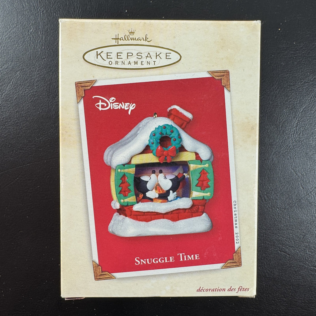 2002 Hallmark Keepsake Disney Snuggle Time light-up Christmas ornament featuring Mickey and Minnie Mouse fireside in box