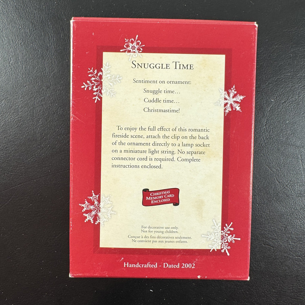 2002 Hallmark Keepsake Disney Snuggle Time light-up Christmas ornament featuring Mickey and Minnie Mouse fireside in box