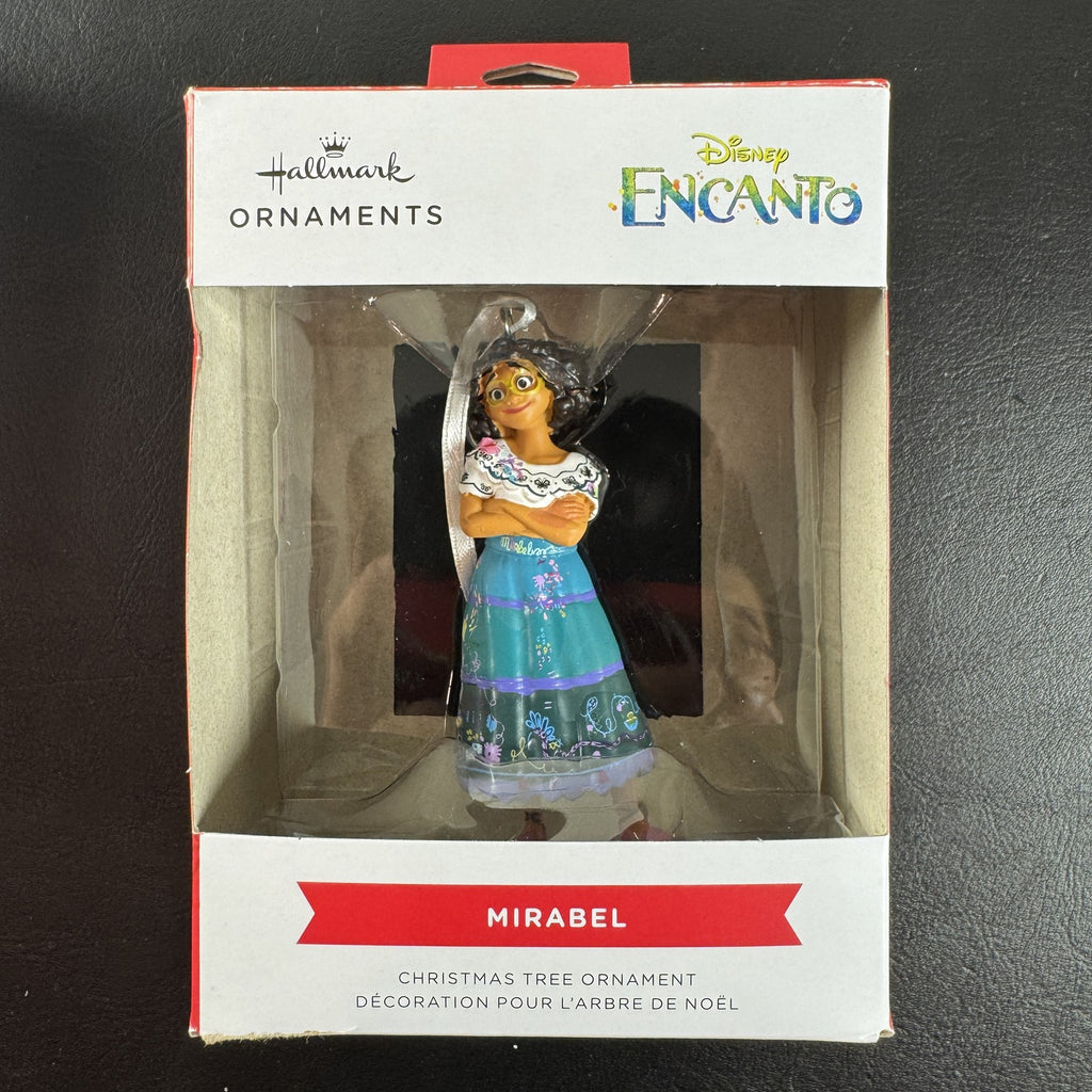 Hallmark Disney Encanto Mirabel Madrigal Christmas ornament in original box showing green glasses and floral skirt