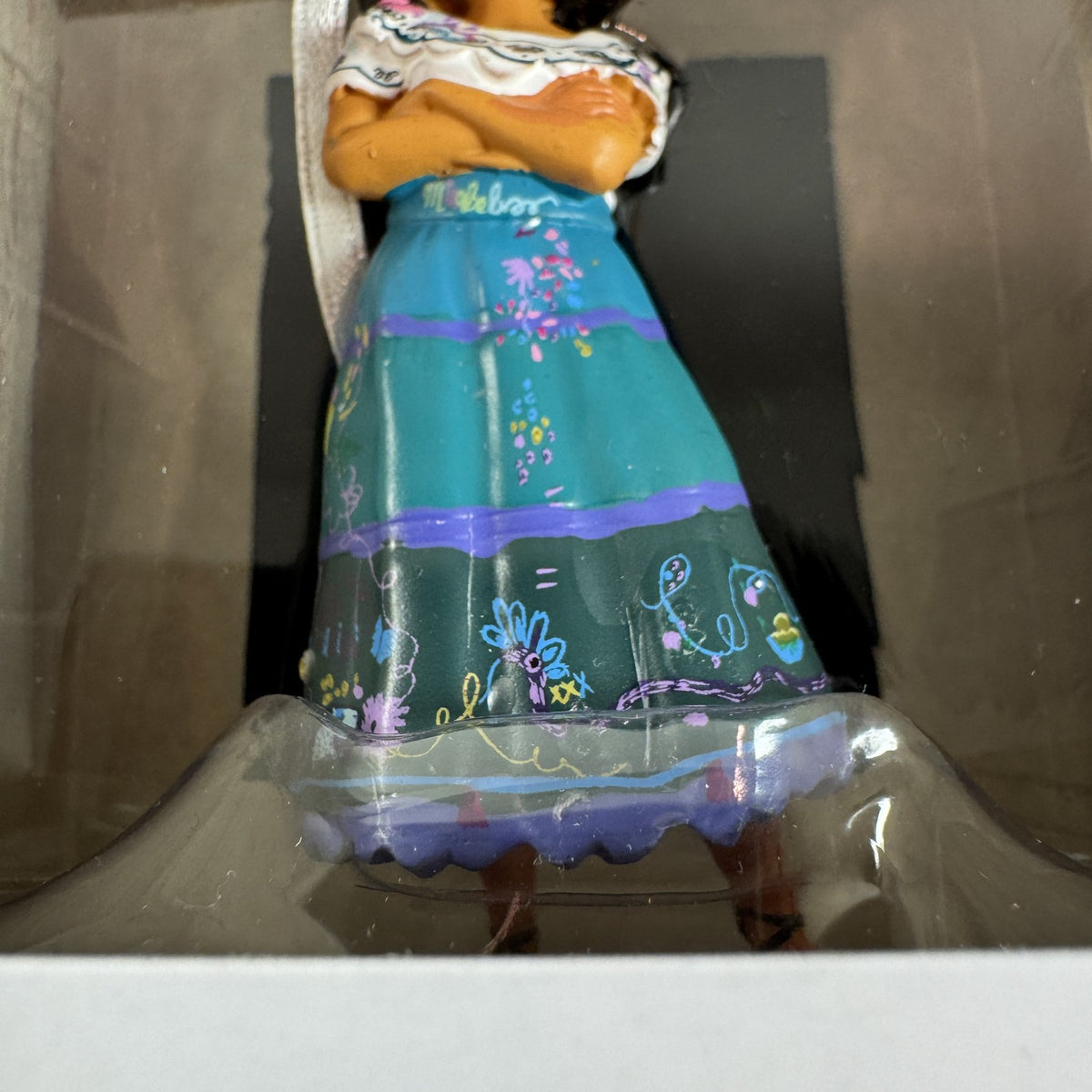 Hallmark Disney Encanto Mirabel Madrigal Christmas ornament in original box showing green glasses and floral skirt
