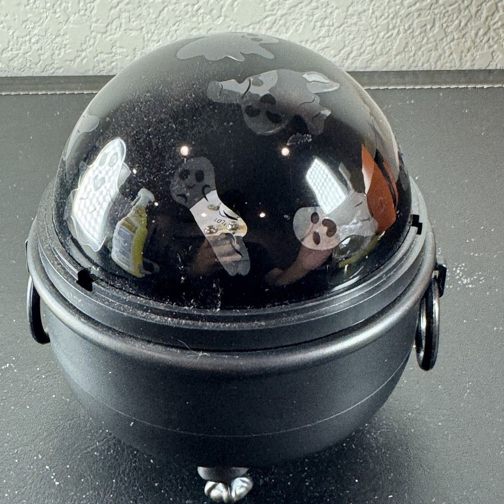 Hyde and EEK Boutique black cauldron LED rotating tabletop light casting ghost shadows