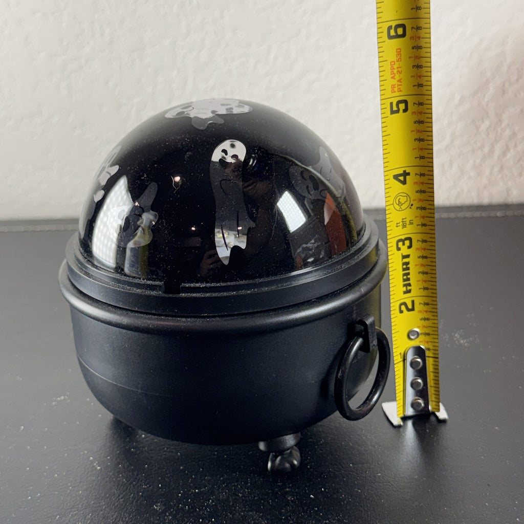 Hyde and EEK Boutique black cauldron LED rotating tabletop light casting ghost shadows