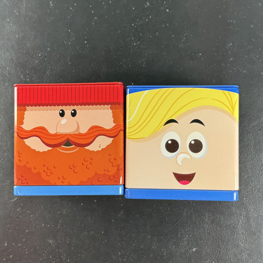 Hallmark Cubeez Rudolph the Red-Nosed Reindeer stackable metal tins set featuring Yukon Cornelius and Hermey.