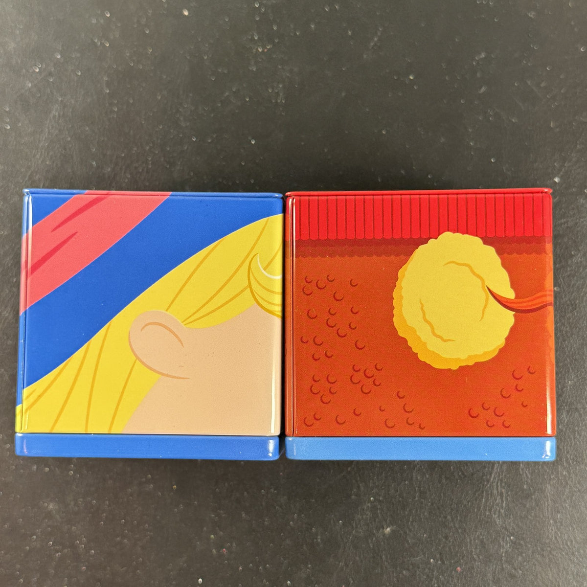 Hallmark Cubeez Rudolph the Red-Nosed Reindeer stackable metal tins set featuring Yukon Cornelius and Hermey.