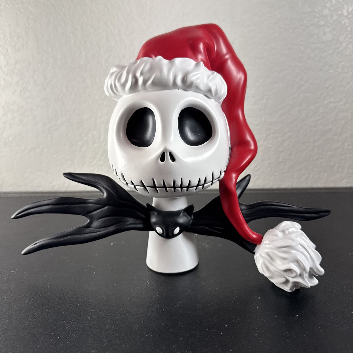 Department 56 Santa Jack Skellington tree topper in stone resin from Disney's The Nightmare Before Christmas