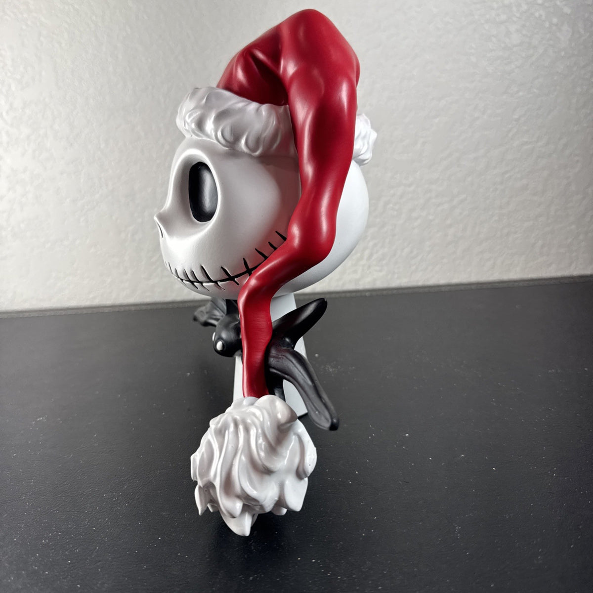 Department 56 Santa Jack Skellington tree topper in stone resin from Disney's The Nightmare Before Christmas