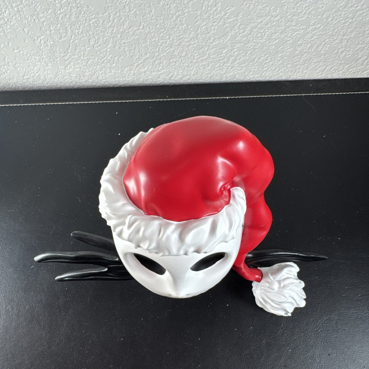 Department 56 Santa Jack Skellington tree topper in stone resin from Disney's The Nightmare Before Christmas