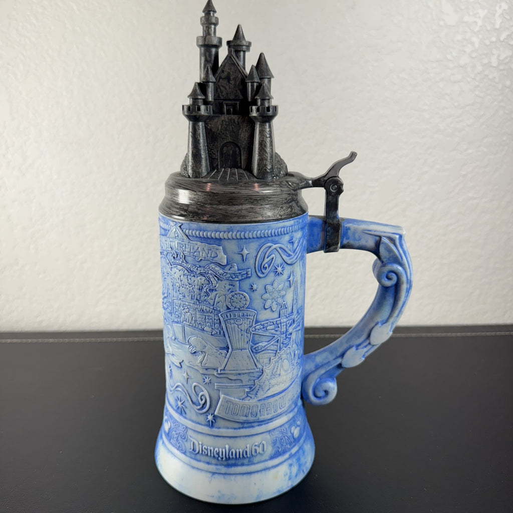 Disney Parks Disneyland 60th Anniversary ceramic lidded beer stein featuring Sleeping Beauty Castle top
