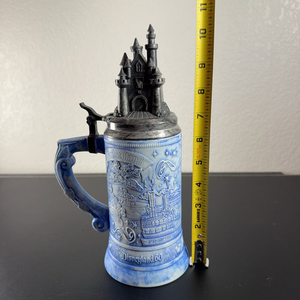 Disney Parks Disneyland 60th Anniversary ceramic lidded beer stein featuring Sleeping Beauty Castle top