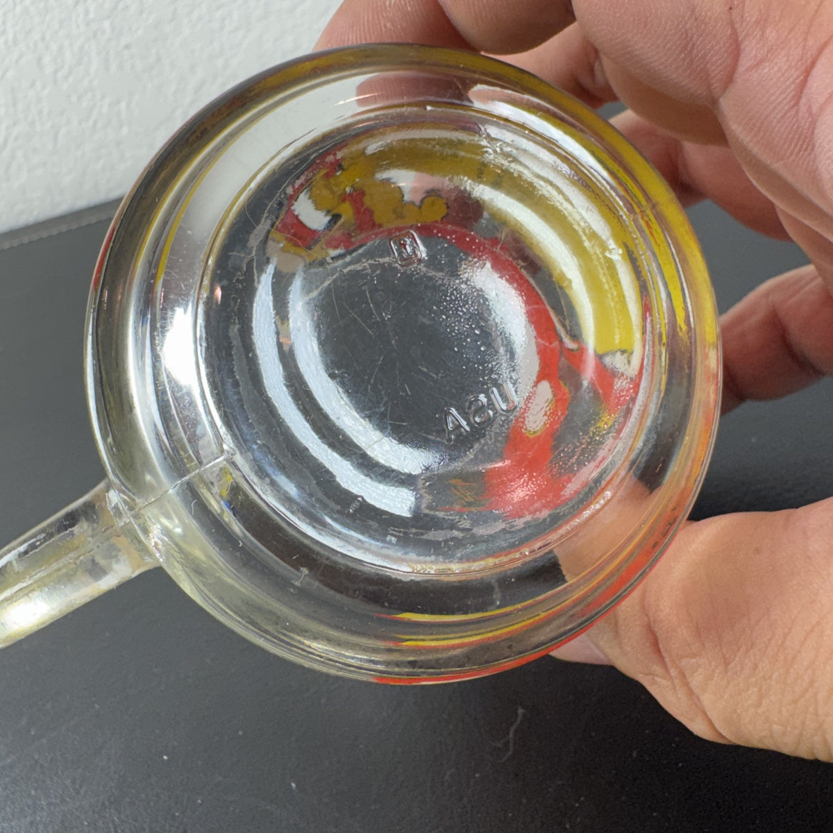 Vintage 1978 McDonald's clear glass mug featuring Garfield on a skateboard pulled by Odie.