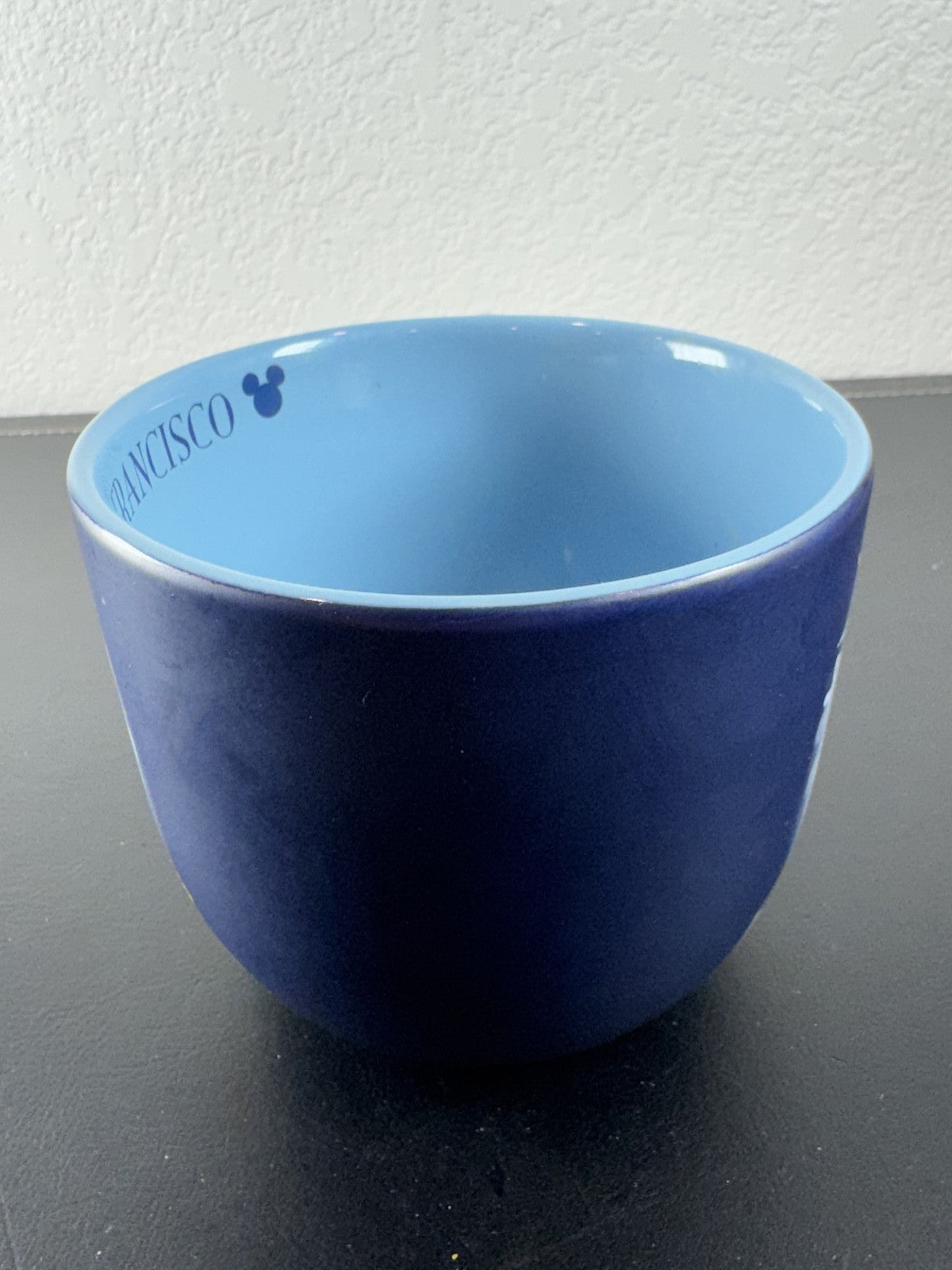 Disney navy blue ceramic mug featuring Mickey Mouse and friends riding a San Francisco cable car