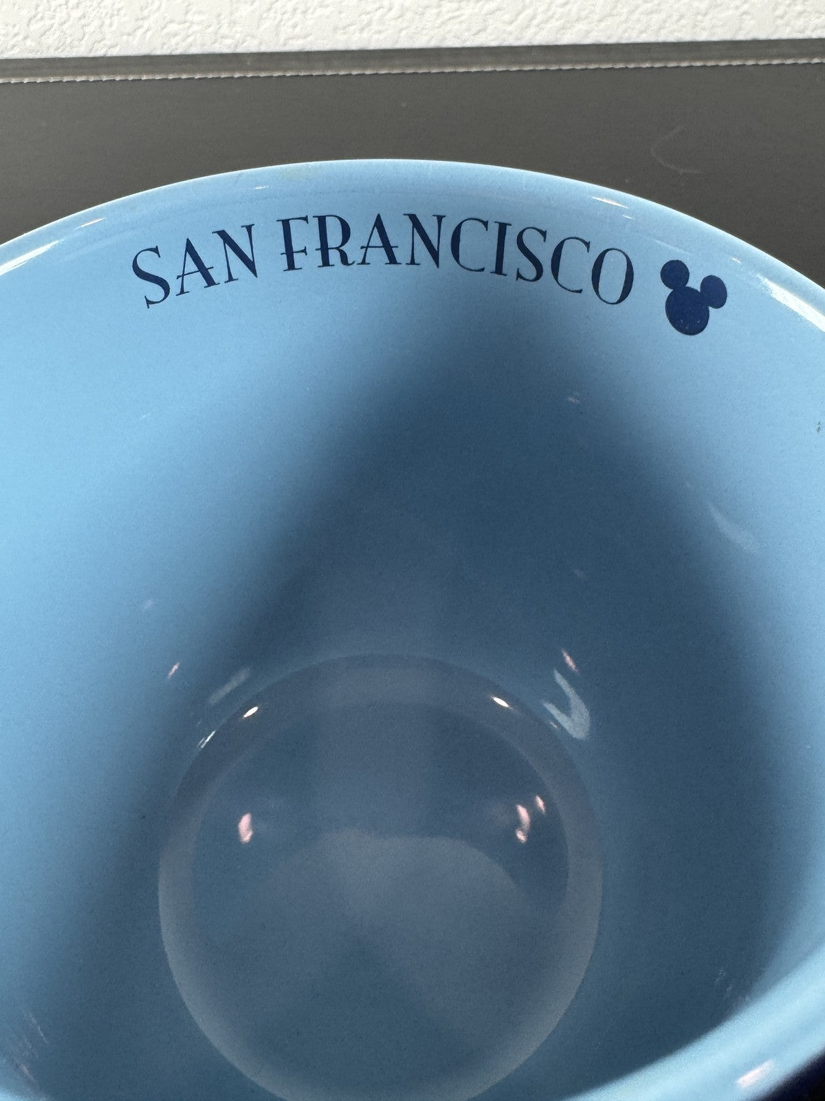 Disney navy blue ceramic mug featuring Mickey Mouse and friends riding a San Francisco cable car