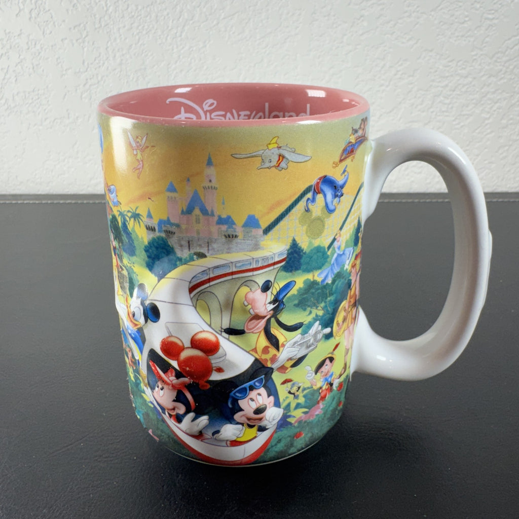 Disneyland park map ceramic coffee mug featuring Mickey Mouse and a pink interior glaze.