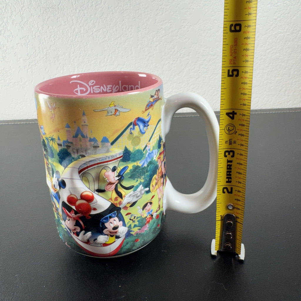 Disneyland park map ceramic coffee mug featuring Mickey Mouse and a pink interior glaze.