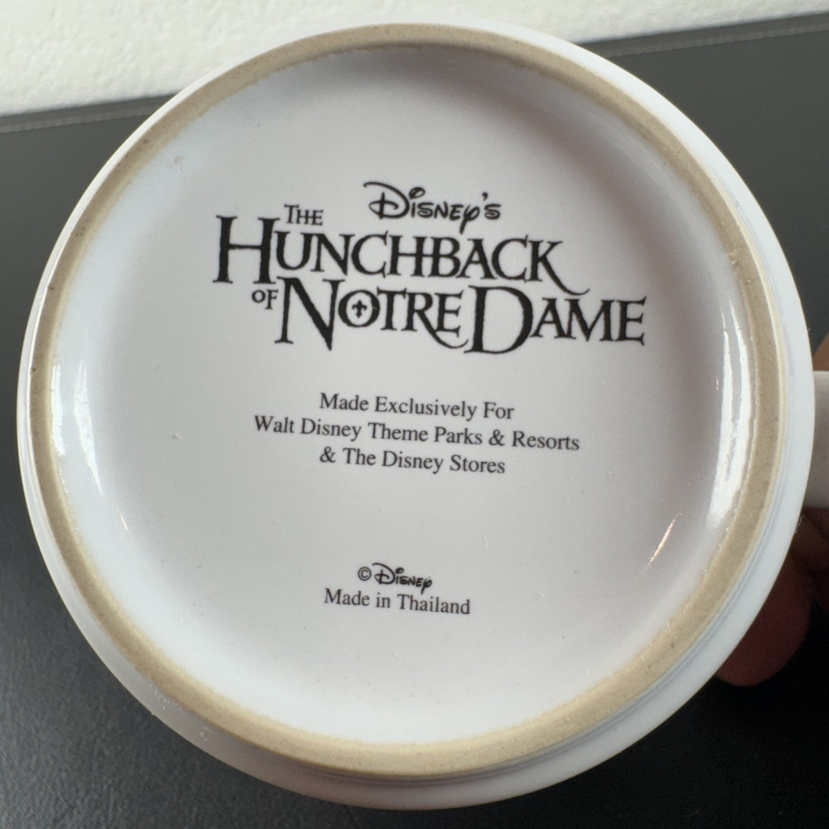 Vintage Disney Hunchback of Notre Dame ceramic mug with Festival of Fools artwork and blue interior.