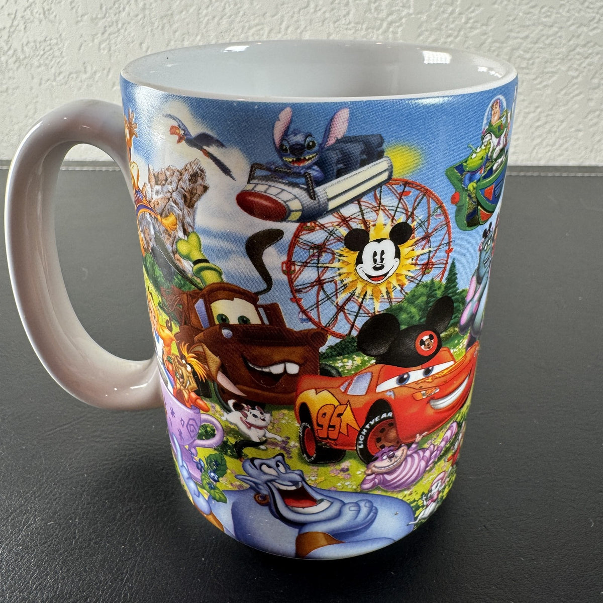 Disney Parks Grandma ceramic mug with Mickey Mouse, Sleeping Beauty Castle, and classic characters wraparound graphic.
