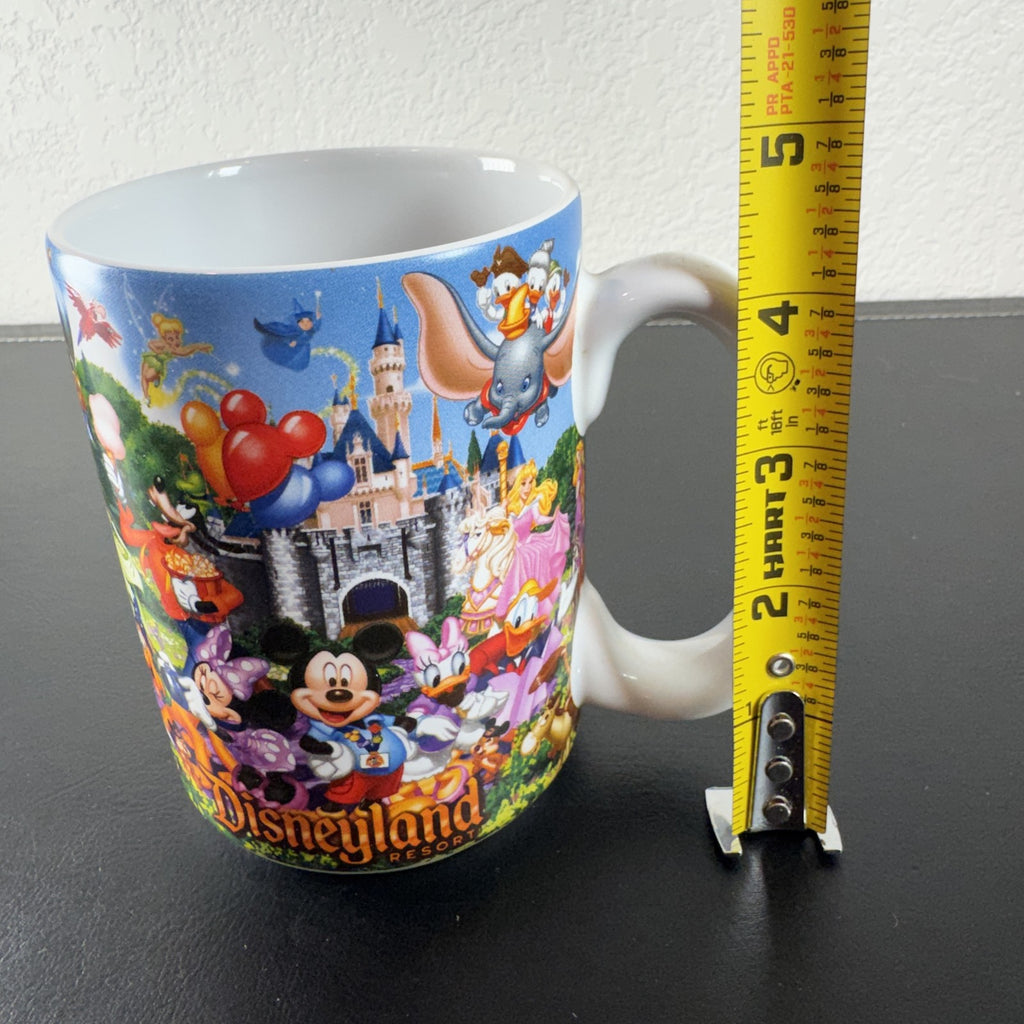 Disney Parks Grandma ceramic mug with Mickey Mouse, Sleeping Beauty Castle, and classic characters wraparound graphic.