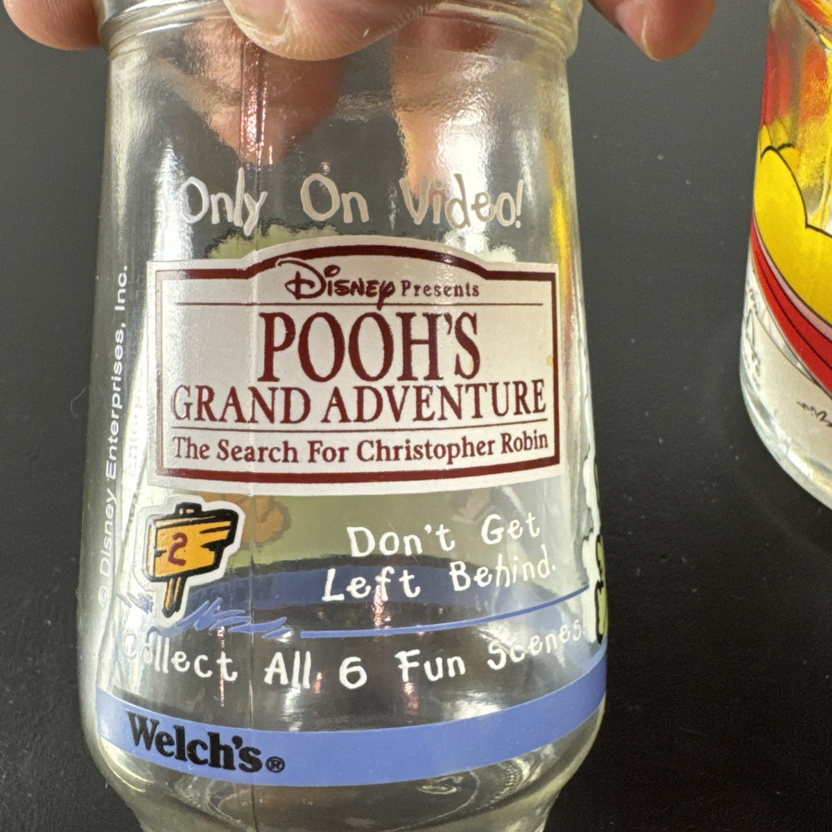 Set of three vintage cartoon promo glasses featuring McDonald's Garfield mug and Welch's jelly jars.