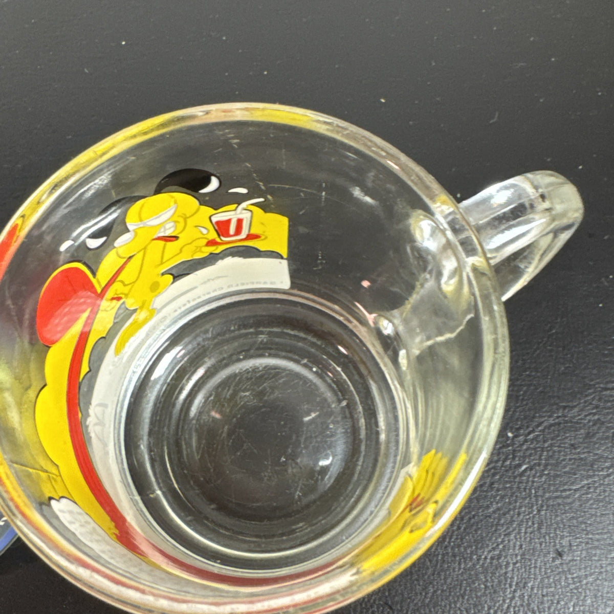 Set of three vintage cartoon promo glasses featuring McDonald's Garfield mug and Welch's jelly jars.