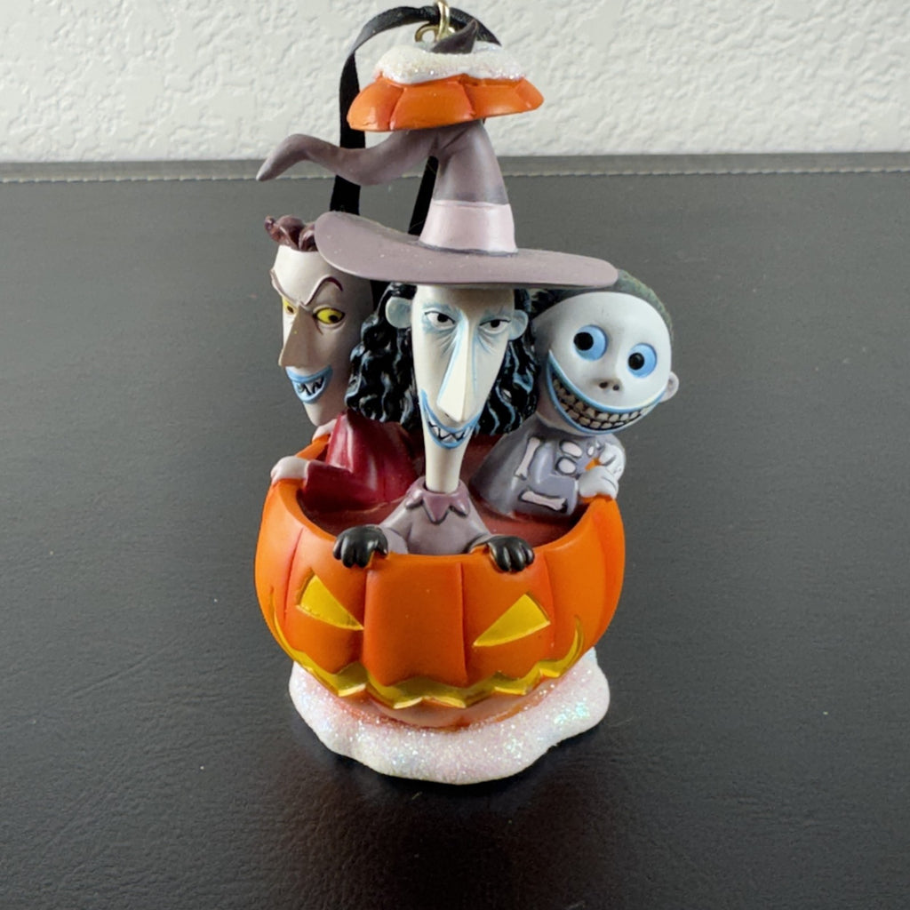 Disney Nightmare Before Christmas Lock, Shock, and Barrel resin pumpkin ornament with glitter base.