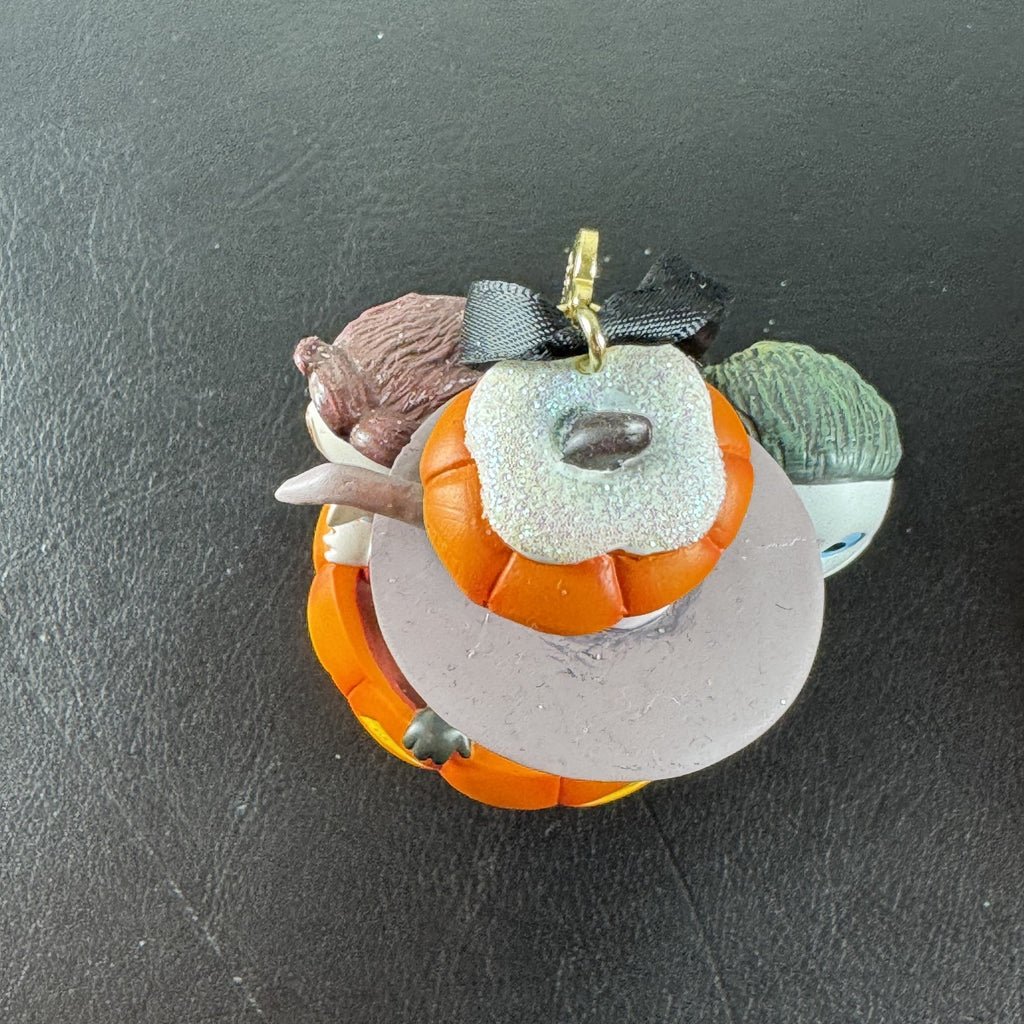 Disney Nightmare Before Christmas Lock, Shock, and Barrel resin pumpkin ornament with glitter base.