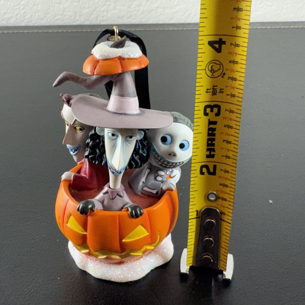 Disney Nightmare Before Christmas Lock, Shock, and Barrel resin pumpkin ornament with glitter base.